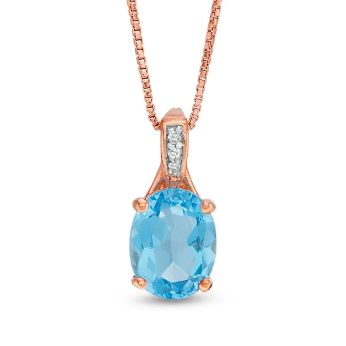 Goldia Necklaces Oval Blue Topaz and Natural Diamond Accent Pendant in Sterling Silver with Rose Rhodium Goldia Necklaces Oval Blue Topaz and Natural Diamond Accent Pendant in Sterling Silver with Rose Rhodium